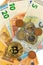 Valid Euro banknotes and Bitcoin. Risk investment. Virtual currency. Online trading.