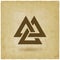 Valknut symbol. interlocked triangles old background