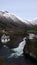 Valldola foss waterfall in river on Trollstigen route in snow in Norway