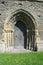 Valle Crucis monastery located near Llangollen and the Dee valley, north Wales. An intact arched, carved, stone doorway.