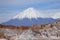 Valle de la Luna Valley of the Moon and Licancabur volcano, Atacama Desert, Chile