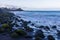 Valle Gran Rey - Black sand beach Playa de La Calera in Valle Gran Rey, La Gomera. Stones covered with green moss.