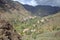 VALLE GRAN REY, LA GOMERA, SPAIN: Mountainous and green landscape with terraced fields and palm trees