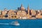Valletta citiscape with bay cruise boat, Malta