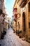 Valletta iconic narrow city streets at sunset