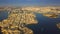 Valletta, Malta - 4K drone flying backwards above Valletta with Grand Harbor, Manoel Island, Sliema, Gzira at summer time