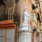 Valletta, Malta, August 2015. View of the Maltese house with a statue of the Apostle Paul and many shops on the lower floor.