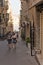 Valletta, Malta, August 2019. A city street with people passing by it.