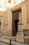 Valletta, Malta, August 2019. A fragment of the pediment of the Catholic Church and a statue of a saint in front of her.