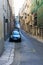 Valletta, Malta, August 2019. Perspective of an old street with car parking.