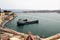 Valletta, Malta, July 2014. View of the old town and cargo ships in the harbor