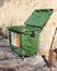 VALLETTA, MALTA - NOVEMBER 10TH 2019: A green rubbish bin stands open near the Valletta bus station. Ghalfejn thammeg pajjizek