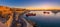 Valletta, Malta - Panoramic shot of an amazing summer sunrise at Valletta`s Grand Harbor with ships