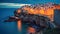 Valletta, Malta: skyline from Marsans Harbour at sunrise warm lights