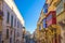 Valletta, Malta - Typical narrow street with colorful traditional windows