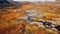 Valley in autumn with a small flowing river in the middle. Yellow fall field with white clouds on a sunny day. Nature composition