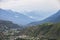 Valley with city of sierre in swiss wallis with high snow capped mountains