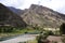 valley with clear water river mountains trees and sky huancavelica peru