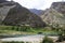 valley with clear water river mountains trees and sky huancavelica peru