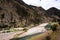 valley with clear water river mountains trees and sky huancavelica peru