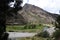 valley with clear water river mountains trees and sky huancavelica peru