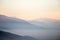 A valley filled by mist at sunset