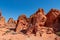 Valley of Fire - Man at exterior entrance of windstone arch (fire cave) in Valley of Fire State Park, Mojave desert, Nevada, USA