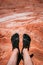 Valley of Fire, Nevada, USA - October 6, 2019: Detail on a person wearing Vibram Five Finger hiking shoes at Fire wave, USA