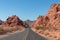 Valley of Fire - Panoramic view of endless winding empty Mouse tank road through canyons of red Aztec Sandstone Rock