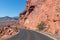 Valley of Fire - Panoramic view of endless winding empty Mouse tank road through canyons of red Aztec Sandstone Rock