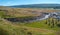 Valley in front of tallest Icelandic waterfall Hengifoss and hiking trail to it, Iceland, summer, sunny day, blue sky
