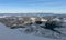 Valley of hilghland mountain winter resort on bright sunny day. Panoramic wide view of downhill slopes