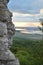 Valley and the lake. Large rock in the foreground at sunset