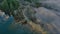 Valley by Lake, Mountains and Green Trees covered in fog. Canadian Landscape Aerial Background