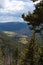 A valley between pine covered mountainsides at a scenic overlook on the Trail Ridge Road in Rocky Mountain National Park