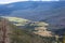 A valley between pine covered mountainsides at a scenic overlook on the Trail Ridge Road in Rocky Mountain National Park