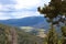 A valley between pine covered mountainsides at a scenic overlook on the Trail Ridge Road in Rocky Mountain National Park