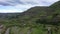 Valley and river among the picturesque mountains. Aerial view