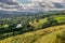 A valley with sheep and rain clouds