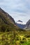 The valley between snow-capped mountains and hills on the road to Te Anau. South Island, New Zealand