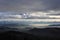 Valley south of Bern in the fog. Swiss alps in the background