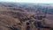 Valley with steep ravines on slopes in autumn, aerial view