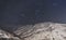 Valmeinier mountains at night stars in winter skiing area in the French Alps Savoie