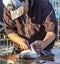 Valparaiso, Chile - 2019-07-30 - Fisherman filets freshly caught fish