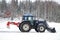 Valtra Tractor Removes Snow with Bucket and Road Drag