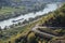 Valwig, Germany - 09 17 2020: serpentine curve above the Mosel with a cargo ship