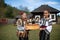 Vama, Romania, September 28th, 2019, Portraiture of young girls holding bread wearing traditional in Bucovina