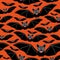 Vampire bats on orange background.