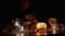 Vampire Boy with in Hood Plays with Spider by Candle in Dark Room on Halloween