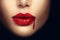 Vampire woman lips with dripping blood